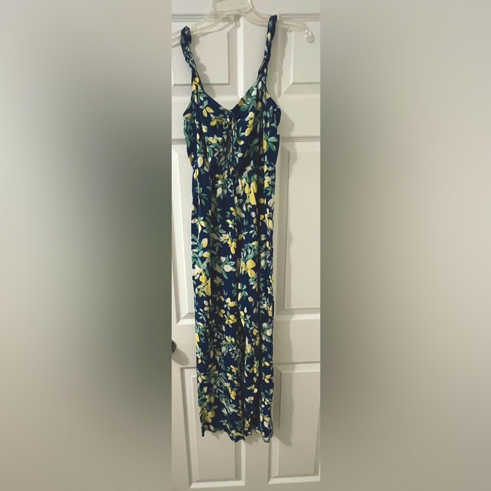 Navy romper with lemons on it